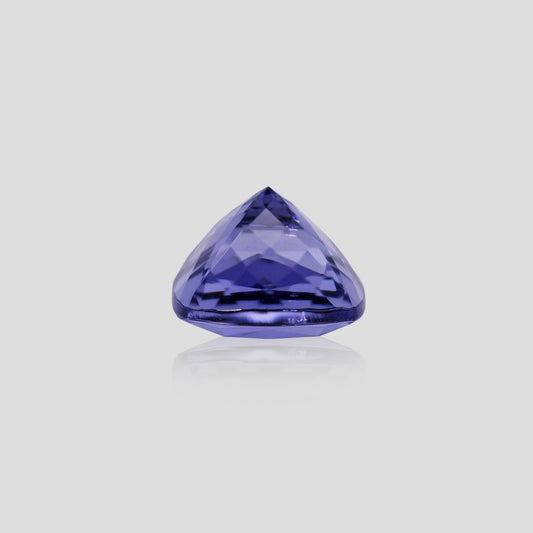 cushion-shaped purple gemstone on a light gray background