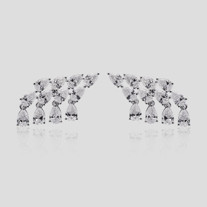 Pair of diamond earrings on a light gray background