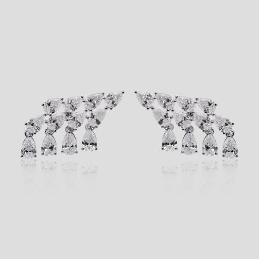 Pair of diamond earrings on a light gray background