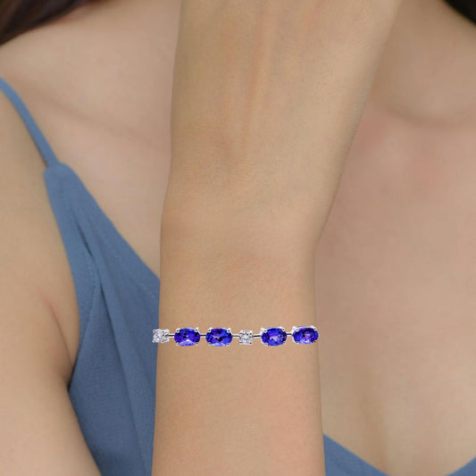Oval tanzanite bracelet with diamond accents on a lady's wrist