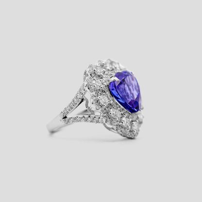 Heart tanzanite Ring with diamond-studded on a light gray background
