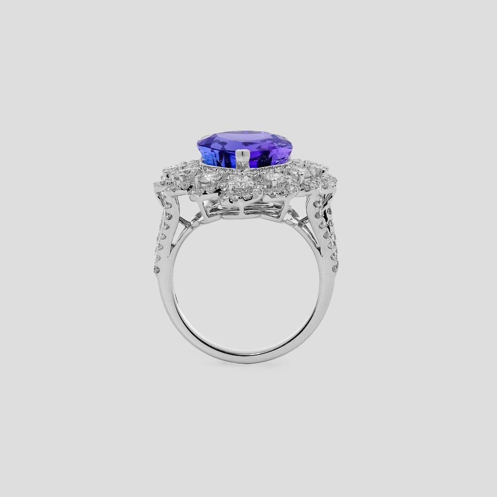 Tanzanite ring with diamonds on a white background