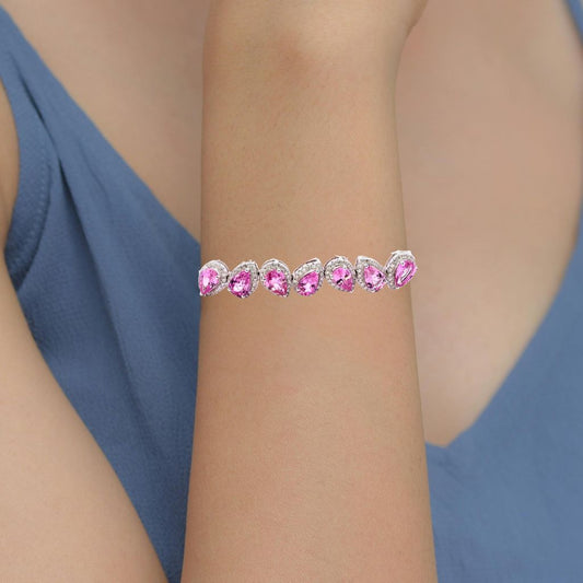 Pink Sapphire Bracelet with diamond accents on a woman's wrist