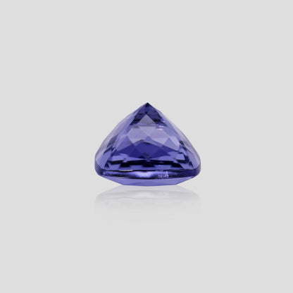 cushion-shaped purple gemstone on a light gray background