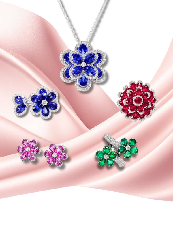 Set of colorful gemstone jewelry on a pink fabric background