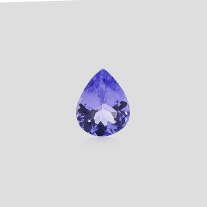 Faceted pear tanzanite 9x7mm on a light gray background